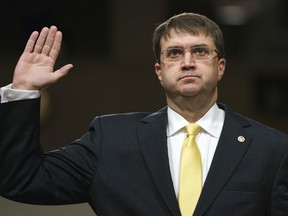 FILE - In a Wednesday, June 27, 2018 file photo, Veterans Affairs Secretary nominee Robert Wilkie is sworn in at the start of a Senate Veterans Affairs Committee nominations hearing on Capitol Hill in Washington. Wilkie is expected to become secretary of Veterans Affairs when the Senate votes Monday, July 23 to confirm him.