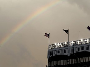 A rainbow appears over Yankee Stadium before a baseball game between the New York Yankees and the New York Mets, Sunday, July 22, 2018, in New York.