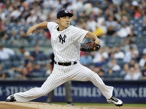 New York Yankees' Masahiro Tanaka,of Japan, delivers a pitch during the first inning of a baseball game against the Baltimore Orioles Tuesday, July 31, 2018, in New York.