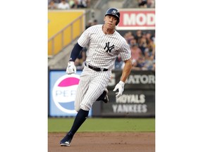 New York Yankees' Aaron Judge runs to third base on a double by Didi Gregorius during the first inning of the team's baseball game against the Kansas City Royals on Thursday, July 26, 2018, in New York.