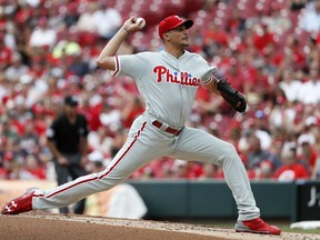 Philadelphia Phillies starting pitcher Zach Eflin throws in the first inning of a baseball game against the Cincinnati Reds, Sunday, July 29, 2018, in Cincinnati.