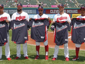 From left, Cleveland Indians' Michael Brantley, Corey Kluber, Francisco Lindor, Yan Gomes and Jose Ramirez hold their All-Star jerseys before playing the New York Yankees in a baseball game, Sunday, July 15, 2018, in Cleveland. Trevor Bauer was warming up for the game and is not pictured.