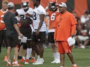 Cleveland Browns head coach Hue Jackson watches an NFL football training camp, Friday, July 27, 2018, in Berea, Ohio.