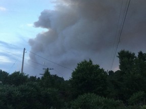 Smoke from a nearby forest fire is seen at the Hartley Bay marina in Alban, Ont. near the French River Provincial Park in this undated handout photo. Crews are continuing to battle dozens of forest fires in northeastern Ontario, after the biggest of the blazes more than doubled in size over the course of a day. The province's Ministry of Natural Resources and Forestry said in a release that as of Saturday night 64 fires were burning in the region, with 29 of them out of control.