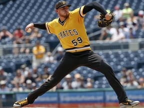 Pittsburgh Pirates starter Joe Musgrove (59) pitches against the Milwaukee Brewers in the first inning of a baseball game, Sunday, July 15, 2018, in Pittsburgh.