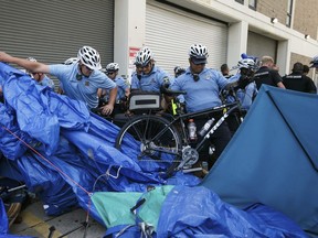 Police confront demonstrators outside the federal Immigration and Customs Enforcement agency on Thursday, July 5, 2018 in Philadelphia.  Several protesters were arrested.