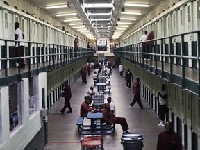 FILE – This Sept. 7, 2017, file photo shows inmates in a block at the State Correctional Institution at Graterford in Graterford, Pa. The first phase of transferring more than 2,500 inmates from the 89-year-old state prison at Graterford to the long-delayed $400 million State Correctional Institution at Phoenix prison in Collegeville, Pa., began Wednesday, July 11, 2018, according to the Pennsylvania Department of Corrections, which plans to bus hundreds of inmates a day to the new prison facility about a mile down the road until all are relocated.