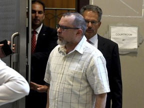 Caliban Book Shop co-owner John Schulman leaves after his arraignment at City Court, Friday morning July 20, 2018 in Pittsburgh. Authorities on Friday charged Schulman and Greg Priore, a Carnegie Library archivist, with stealing millions of dollars' worth of rare books, illustrations, maps and photographs from a Pittsburgh library over a 20-year period.