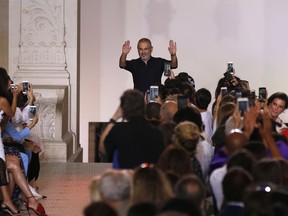 Lebanese designer Elie Saab accepts applause after his Haute Couture Fall-Winter 2018/2019 fashion collection Wednesday, July 4, 2018 in Paris.