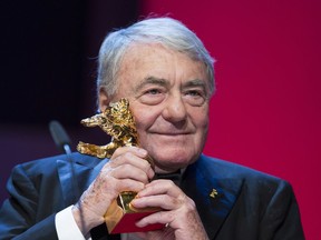 FILE - In this Feb.14, 2013 file photo, French film director Claude Lanzmann holds the Honorary Golden Bear at the 63rd edition of the Berlinale, International Film Festival in Berlin, Germany. Lanzmann, director of the epic movie 'Shoah,' has died at age 92 his publisher said Thursday, July 5, 2018.