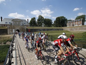 The pack starts the ninth stage of the Tour de France cycling race over 156.5 kilometers (97.2 miles) with start in Arras and finish in Roubaix, France, Sunday, July 15, 2018.