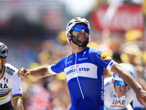 Colombia's Fernando Gaviria crosses the finish line ahead of Peter Sagan of Slovakia, left, and Norway's Alexander Kristoff, right, to win the first stage of the Tour de France cycling race over 201 kilometers (124.9 miles) with start in Noirmoutier-en-L'Ile and finish in Fontenay Le-Comte, France, Saturday, July 7, 2018.