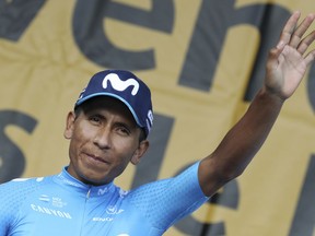 Colombia's Nairo Quintana greets spectators during the Tour de France cycling race team presentation in La Roche-sur-Yon, Vendee region, France, Thursday, July 5, 2018, ahead of upcoming Saturday's start of the race.