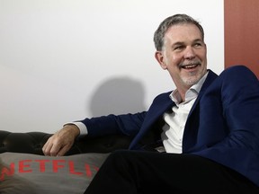 FILE - In this Feb. 28, 2017, file photo, Netflix Founder and CEO Reed Hastings smiles during an interview in Barcelona, Spain. Prominent charter school supporters are dishing out campaign money, as key gubernatorial races in several states have now begun in earnest. Hastings and philanthropist Laurene Powell Jobs donated $29,200 each, the maximum amount, to Democrat Gavin Newsom's campaign for California governor.