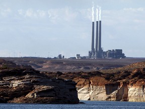 *FILE - This Sept. 4, 2011 file photo shows the main plant facility at the Navajo Generating Station northeast of Grand Canyon National Park as seen from Lake Powell in Page, Ariz. A new study concludes visitors may be steering clear of some U.S. national parks or cutting their visits short because of pollution.