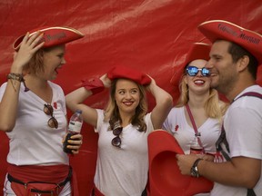 Revellers get ready for the launch of the 'Chupinazo' rocket, to celebrate the official opening of the 2018 San Fermin fiestas with daily bull runs, bullfights, music and dancing in Pamplona, Spain, Friday July 6, 2018.