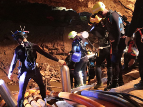 A group of Thai Navy divers in Tham Luang cave during rescue operations for the 12 boys and their football team coach trapped in the cave at Khun Nam Nang Non Forest Park.