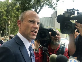 Porn actress Stormy Daniels' lawyer Michael Avenatti talks to the media outside of Los Angeles County Superior Court after a hearing in Los Angeles Tuesday, July 10, 2018. A judge has ordered a former Playboy centerfold model to provide copies of a lawsuit she filed last week to Avenatti and a top fundraiser for President Donald Trump. Los Angeles County Superior Court Judge Ernest Hiroshige handed down the ruling Monday, but denied requests to make the lawsuit public. Shera Bechard is suing Elliott Broidy, who disclosed last spring the two had an affair, and agreed to pay her $1.6 million as part of a confidentiality agreement. The suit also names Bechard's former attorney, Keith Davidson, and Avenatti.