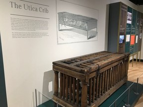 In this Aug. 29, 2018, photo, a cage for humans known as the Utica Crib is displayed at the National Museum of Psychology in Akron, Ohio. It was used in early asylums to restrain mental patients in their beds.