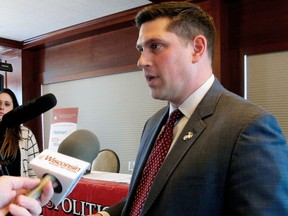 FILE - In this Jan. 30, 2018 file photo, Wisconsin Republican Senate candidate Kevin Nicholson speaks with reporters in Madison, Wis. In an op-ed for Fox News published on Monday, July 16, 2018, Nicholson wrote about his parents' support for his challenger, Democratic Sen. Tammy Baldwin. Nicholson says his parents' decision to support his Democratic opponent is a "true representation" of political intolerance.