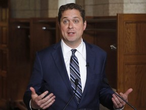 Conservative Leader Andrew Scheer speaks to reporters following a caucus meeting on Parliament Hill on June 6, 2018.