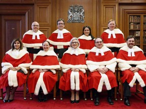 The Supreme Court Justices pose for a group photo in 2016. Most Canadians would have utterly no idea who these people are or why they're dressed like Santa Claus.