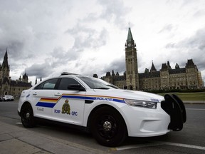 A man has been arrested after trying to stab a soldier on Parliament Hill this morning. An RCMP vehicle is seen on Parliament Hill, in Ottawa on Monday, July 23, 2018.