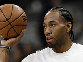 In this Jan. 5 file photo, San Antonio Spurs forward Kawhi Leonard handles a ball before a game against the Phoenix Suns.