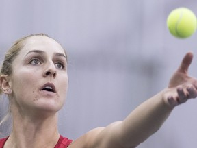 In this April 22 file photo, Gabriela Dabrowski serves against Kateryna Bondarenko at the Fed Cup tennis tournament in Montreal.