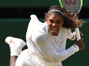 Serena Williams serves against Julia Goerges during their women’s singles semifinal match at Wimbledon 2018 on July 12, 2018. Williams won the match 6-2, 6-4.