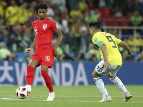 England's Marcus Rashford, left, is challenged by Colombia's Radamel Falcao during the round of 16 match between Colombia and England at the 2018 soccer World Cup in the Spartak Stadium, in Moscow, Russia, Tuesday, July 3, 2018.