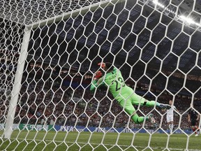 England's Kieran Trippier beats Croatia goalkeeper Danijel Subasic to score the opening goal from a free kick during the semifinal match between Croatia and England at the 2018 soccer World Cup in the Luzhniki Stadium in Moscow, Russia, Wednesday, July 11, 2018.