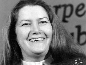 FILE - In this March 1, 1977, file photo, Australian author Colleen McCullough laughs during a news conference in New York. An Australian judge ruled on Friday, July 20, 2018 that best-selling author Colleen McCullough's widower was the sole beneficiary of her estate following a bitter court wrangle. (AP Photo/File)