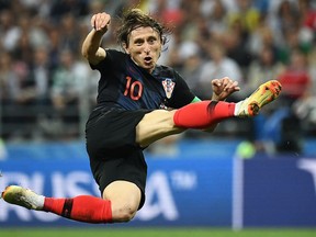 Croatia midfielder Luka Modric attempts a shot against England in the World Cup semifinals on July 11.