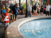 People read messages remembering the victims of a shooting on Sunday evening on Danforth, Ave. in Toronto on Monday, July 23, 2018.