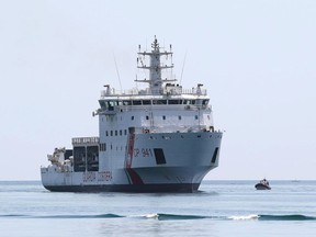 The Diciotti ship of the Italian Coast Guard, with 67 migrants on board rescued 4 days ago by the Vos Thalassa freighter, enters the Sicilian port of Trapani, southern Italy, Thursday, July 12, 2018. The top security officials of Germany, Italy and Austria are touting their hard line on migration issues, saying Europe needs to protect its exterior borders and crack down on human smuggling.