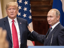  U.S. President Donald Trump and Russian President Vladimir Putin shake hands during a joint press conference after their summit on July 16, 2018 in Helsinki, Finland.