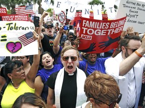 FILE - In this June 28, 2018 file photo, protesters chant "Families belong together!" as they walk to the front doors of the federal courthouse in Brownsville, Texas, to bring attention to the U.S. immigration policy. A federal judge, responding to a plan to reunify children separated at the border, said he was having second thoughts about his belief that the Trump administration was acting in good faith to comply with his orders. The Justice Department on Friday, July 13 filed a plan to reunify more than 2,500 children 5 years old and older by a court-imposed deadline of July 26 using "truncated" procedures to verify parentage and perform background checks that excludes DNA testing and other steps it took to reunify children under 5. The administration said the abbreviated vetting puts children at significant safety risk but is needed to meet the deadline.