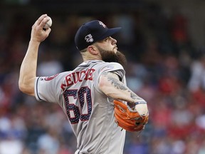 Houston Astros starting pitcher Dallas Keuchel (60) throws during the first inning of a baseball game against the Texas Rangers, Tuesday, July 3, 2018, in Arlington, Texas.