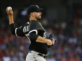 Chicago White Sox starting pitcher Carlos Rodon (55) throws during the first inning of a baseball game against the Texas Rangers, Saturday, June 30, 2018, in Arlington, Texas.
