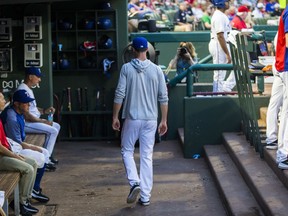 Texas Rangers pitcher Cole Hamels walks out of the Rangers' dugout during the third inning of the team's baseball game against the Oakland Athletics on Thursday, July 26, 2018, in Arlington, Texas.