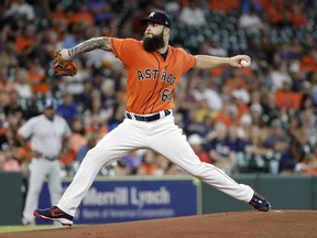 Houston Astros starting pitcher Dallas Keuchel throws to a Texas Rangers batter during the first inning of a baseball game Friday, July 27, 2018, in Houston.