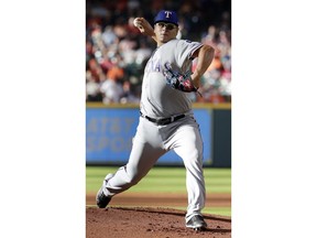 Texas Rangers starting pitcher Ariel Jurado throws against the Houston Astros during the first inning of a baseball game Saturday, July 28, 2018, in Houston.