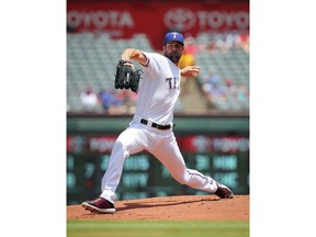 Texas Rangers starting pitcher Cole Hamels delivers against the Chicago White Sox in the first inning of a baseball game Sunday, July 1, 2018, in Arlington, Texas.