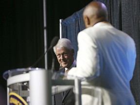 Former President Bill Clinton reacts to comments from former San Francisco Mayor Willie L. Brown after Clinton presented him with the Thalheimer Spingarn Medal during the 109th annual National Association for the Advancement of Colored People convention at the Henry B. Gonzalez Convention Center in San Antonio, Texas, Wednesday, July 18, 2108.