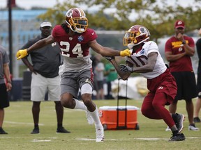 Washington Redskins defensive back Josh Norman (24) covers wide receiver Paul Richardson (10) during the morning session at NFL football training camp in Richmond, Va., Tuesday, July 31, 2018.