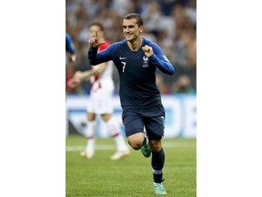 France's Antoine Griezmann celebrates after scoring on a penalty his side' second goal during the final match between France and Croatia at the 2018 soccer World Cup in the Luzhniki Stadium in Moscow, Russia, Sunday, July 15, 2018.