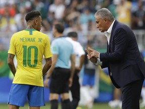 Brazil head coach Tite, right, talks to Brazil's Neymar, left, during the round of 16 match between Brazil and Mexico at the 2018 soccer World Cup in the Samara Arena, in Samara, Russia, Monday, July 2, 2018.