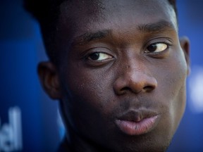 Vancouver Whitecaps midfielder Alphonso Davies pauses during a news conference at the MLS soccer team's training facility in Vancouver, on Thursday July 26, 2018. Davies missed three games as negotiations took place over his record-breaking US$22-million transfer to Bayern Munich of the German Bundesliga, but the 17-year-old was back in B.C. for training with his teammates on Thursday.