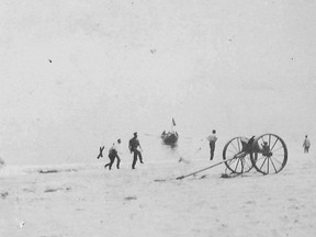 In this photo provided by the Orleans Historical Society, a crew prepares to receive survivors of a German World War I submarine attack on Orleans, Mass., on July 21, 1918. Orleans was the only town on U.S. soil to receive enemy gunfire during World War I. (Courtesy of Orleans Historical Society via AP)